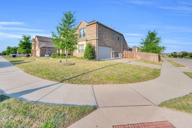 717 Willowbranch Ln, Midlothian, TX 76065 - view of side of property with a garage, fence, a yard, and driveway