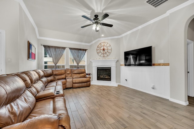 717 Willowbranch Ln, Midlothian, TX 76065 - living room with arched walkways, a ceiling fan, visible vents, and light wood-style floors