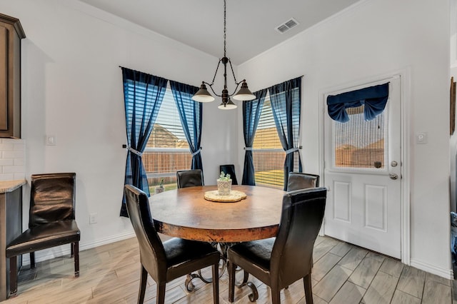 717 Willowbranch Ln, Midlothian, TX 76065 - dining room featuring crown molding, a chandelier, baseboards, and visible vents