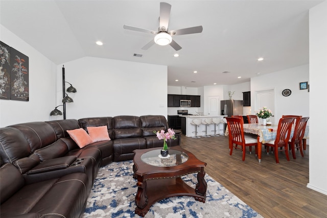 living room featuring dark wood-type flooring, visible vents, a ceiling fan, and recessed lighting