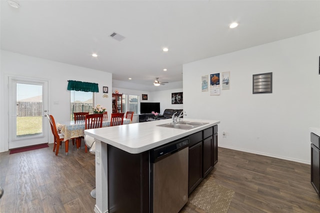 kitchen with visible vents, dishwasher, light countertops, and a sink