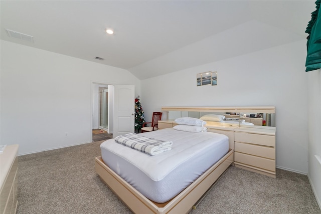 carpeted bedroom with baseboards, visible vents, and lofted ceiling