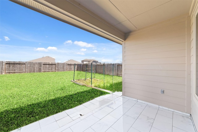 view of yard with a patio area and a fenced backyard