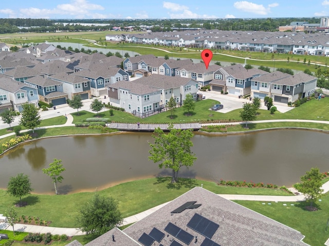 aerial view with a water view and a residential view