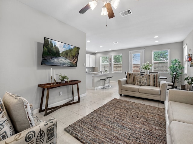 living area with visible vents, baseboards, recessed lighting, a ceiling fan, and light tile patterned floors
