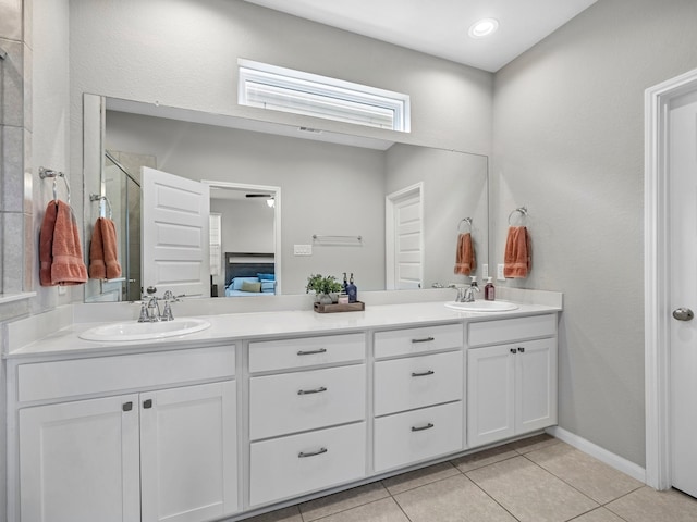 bathroom featuring a sink, tile patterned flooring, and double vanity