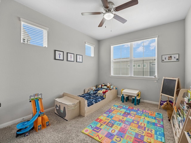 bedroom with baseboards, ceiling fan, and carpet