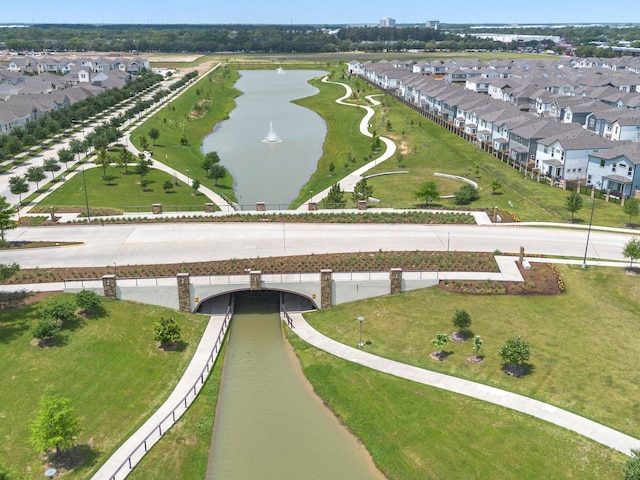 drone / aerial view featuring a water view and a residential view