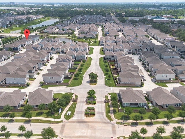 aerial view with a water view and a residential view