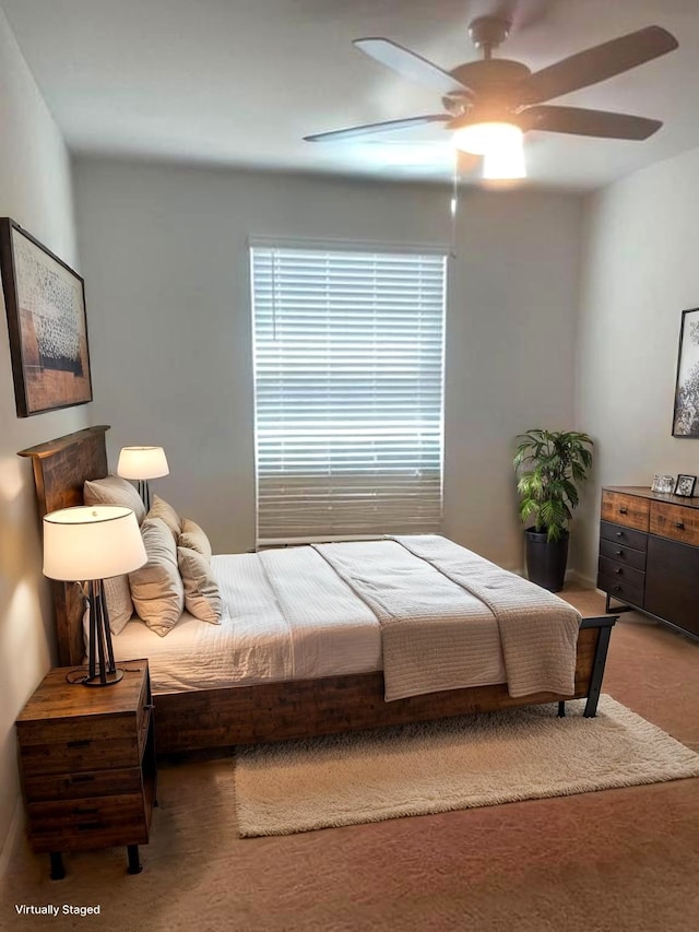 985 Harper Ln, Bryan, TX 77803 - carpeted bedroom featuring a ceiling fan