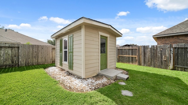 view of outbuilding featuring an outdoor structure and a fenced backyard