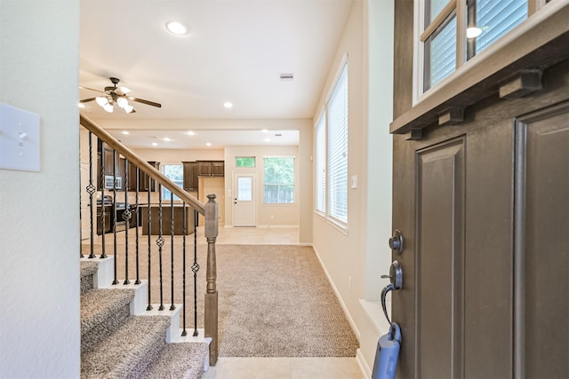 entrance foyer with recessed lighting, stairway, ceiling fan, baseboards, and light colored carpet