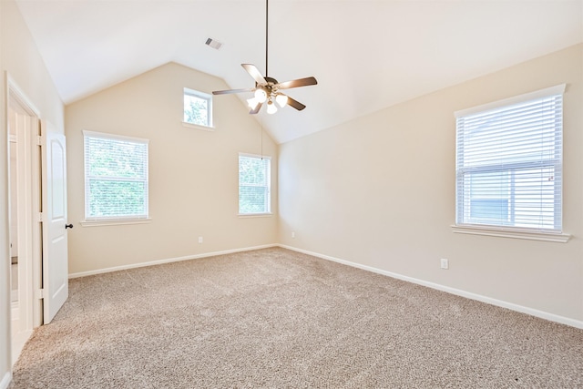 carpeted spare room featuring baseboards, visible vents, a ceiling fan, and lofted ceiling