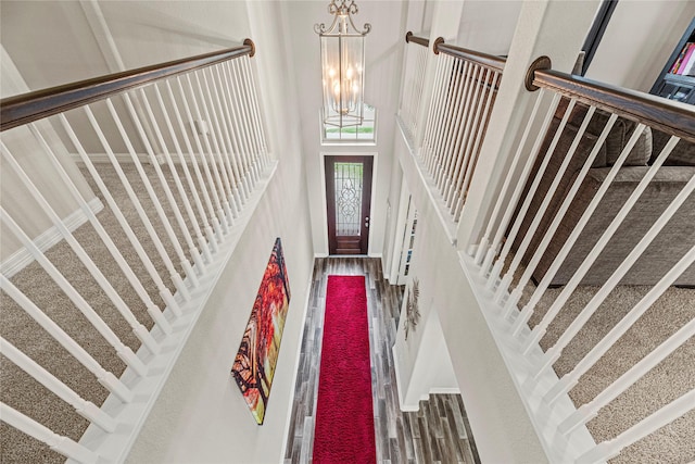 20535 Kohle Springs Ln, Cypress, TX 77433 - foyer with a towering ceiling, stairway, wood finished floors, and a chandelier