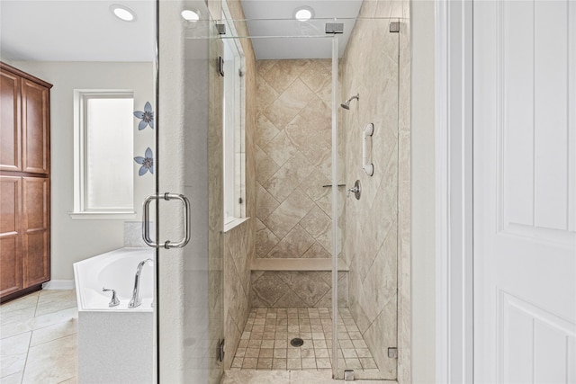 20535 Kohle Springs Ln, Cypress, TX 77433 - bathroom featuring a garden tub, tile patterned flooring, and a shower stall