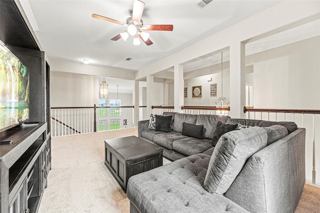 20535 Kohle Springs Ln, Cypress, TX 77433 - living room with visible vents, ceiling fan with notable chandelier, and light carpet