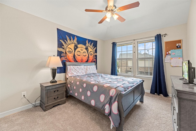 20535 Kohle Springs Ln, Cypress, TX 77433 - bedroom featuring lofted ceiling, baseboards, a ceiling fan, and light carpet