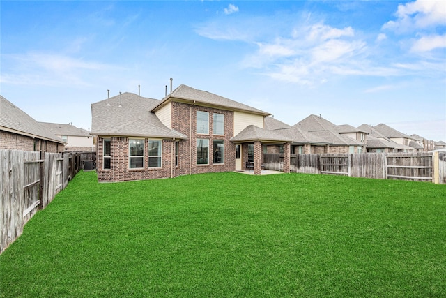 20535 Kohle Springs Ln, Cypress, TX 77433 - rear view of property with brick siding, a fenced backyard, and a lawn