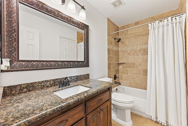 bathroom with visible vents, tile patterned flooring, shower / tub combo, vanity, and toilet