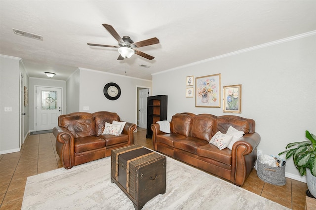 923 N Hull St, Caldwell, TX 77836 - tiled living room featuring ornamental molding and ceiling fan