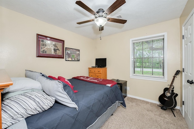 923 N Hull St, Caldwell, TX 77836 - bedroom with light carpet and a ceiling fan