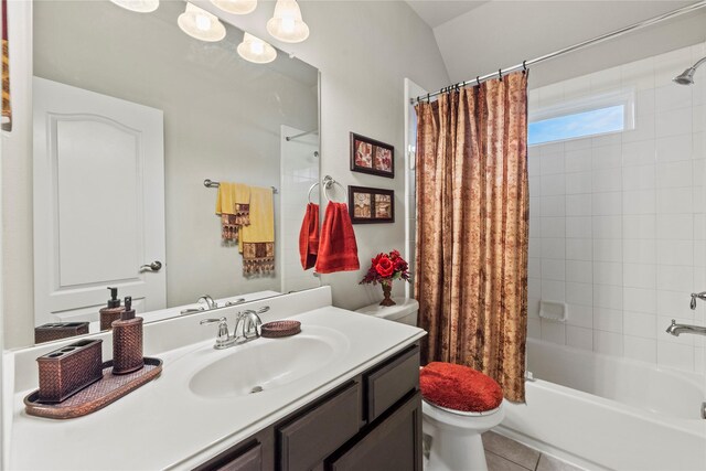 bathroom featuring tile patterned floors, shower / bathtub combination with curtain, vanity, and toilet