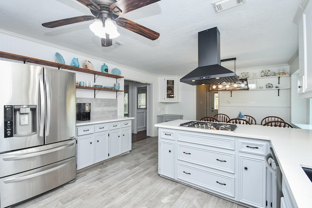 14619 Rosehill Dr, Houston, TX 77070 - kitchen with stainless steel appliances, island range hood, light countertops, open shelves, and ornamental molding