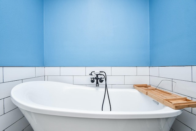14619 Rosehill Dr, Houston, TX 77070 - full bathroom featuring a freestanding tub and tile walls