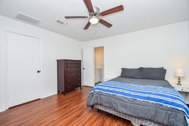 14619 Rosehill Dr, Houston, TX 77070 - bedroom with wood finished floors, ceiling fan, and ensuite bathroom