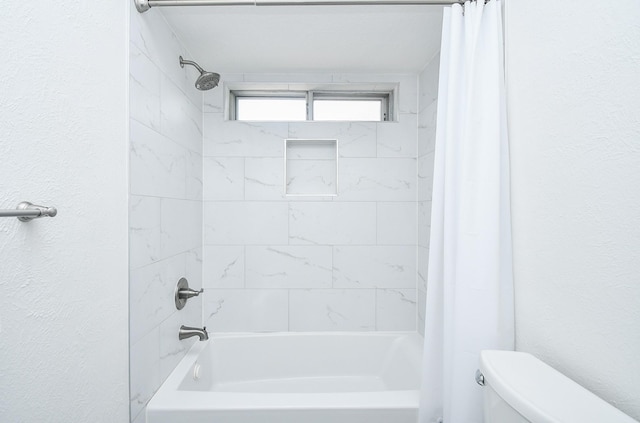 14619 Rosehill Dr, Houston, TX 77070 - bathroom featuring toilet, shower / bath combo, and a textured wall