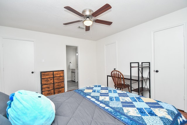 14619 Rosehill Dr, Houston, TX 77070 - bedroom with wood finished floors, ensuite bath, and a ceiling fan