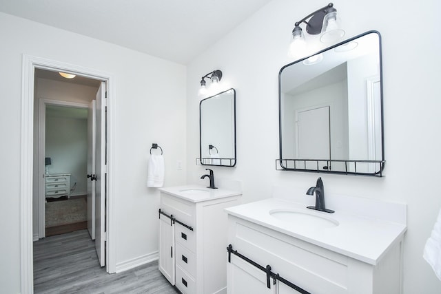 14619 Rosehill Dr, Houston, TX 77070 - full bath featuring two vanities and wood finished floors