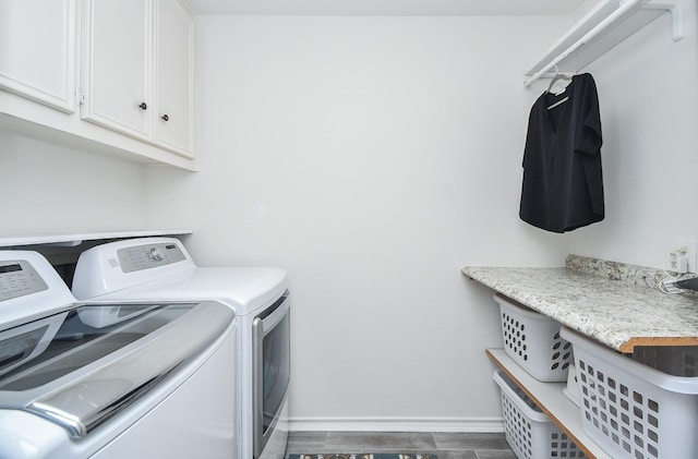 14619 Rosehill Dr, Houston, TX 77070 - laundry room featuring separate washer and dryer, cabinet space, baseboards, and dark wood-type flooring