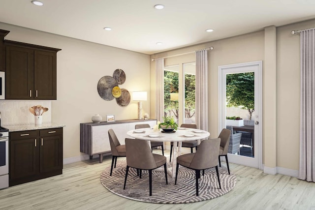 dining area featuring light wood-type flooring, recessed lighting, and baseboards