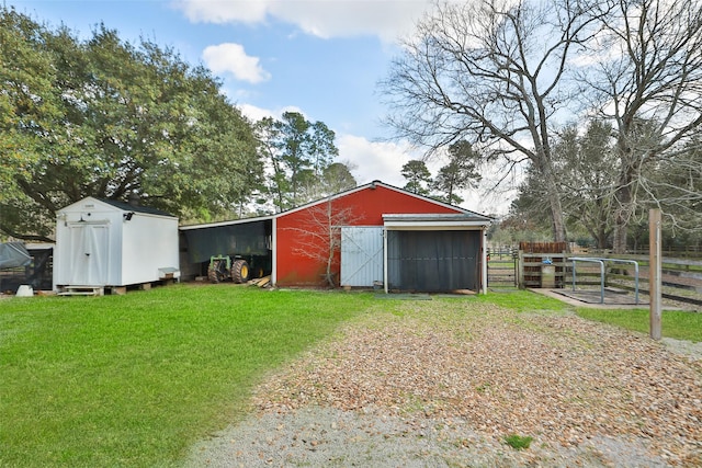 36003 Post Oak Cir, Magnolia, TX 77355 - view of pole building with a lawn and fence