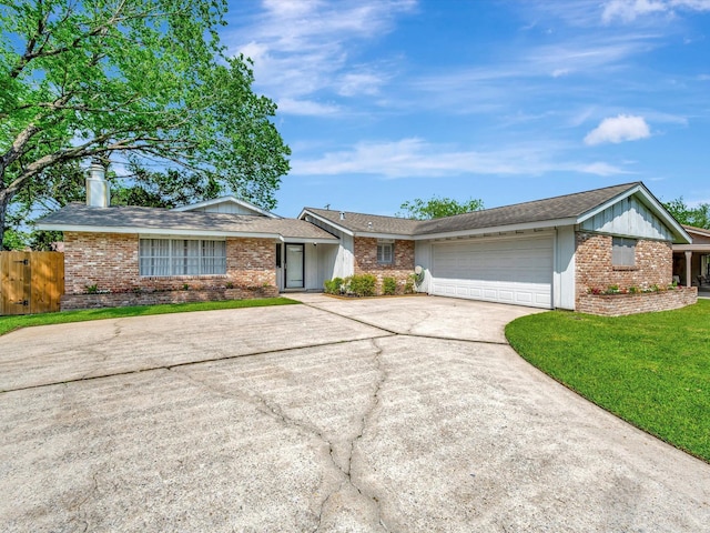 208 Burnett Dr, Baytown, TX 77520 - ranch-style home featuring a garage, a chimney, concrete driveway, and brick siding