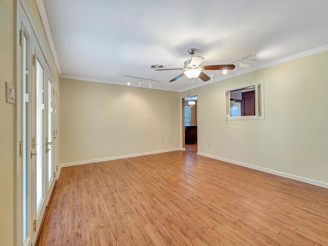 208 Burnett Dr, Baytown, TX 77520 - unfurnished room featuring track lighting, crown molding, light wood-style floors, and ceiling fan