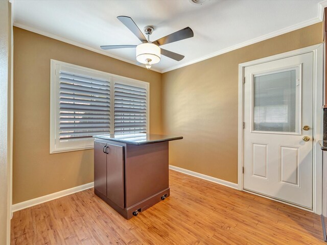 208 Burnett Dr, Baytown, TX 77520 - unfurnished office featuring a ceiling fan, baseboards, ornamental molding, and light wood-type flooring