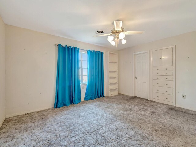 208 Burnett Dr, Baytown, TX 77520 - unfurnished bedroom with carpet floors, baseboards, a ceiling fan, and visible vents