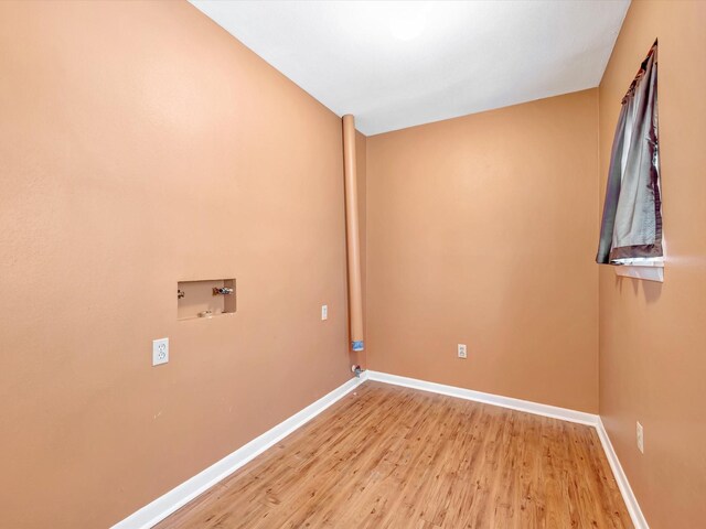 208 Burnett Dr, Baytown, TX 77520 - laundry room with light wood-style floors, baseboards, laundry area, and hookup for a washing machine