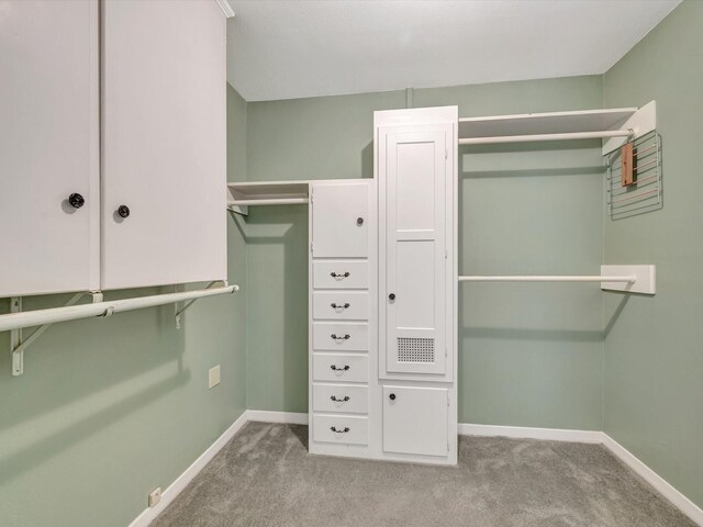 208 Burnett Dr, Baytown, TX 77520 - spacious closet featuring carpet floors