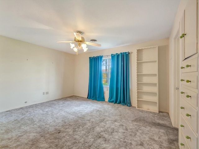 208 Burnett Dr, Baytown, TX 77520 - empty room with a ceiling fan, visible vents, and carpet