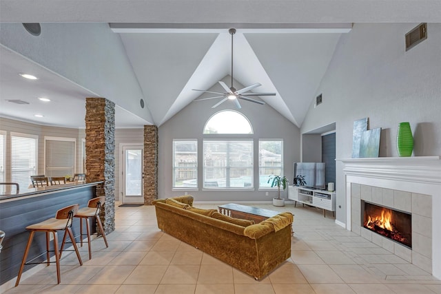 16015 Maycrest Ct, Tomball, TX 77377 - living area with a fireplace, a ceiling fan, light tile patterned flooring, and visible vents