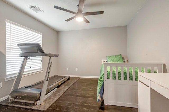 16015 Maycrest Ct, Tomball, TX 77377 - exercise room with baseboards, ceiling fan, wood finished floors, and visible vents