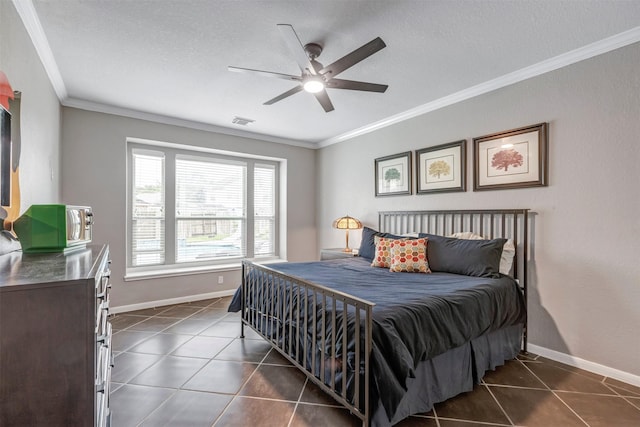 16015 Maycrest Ct, Tomball, TX 77377 - bedroom with dark tile patterned flooring, visible vents, and ornamental molding