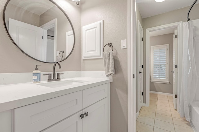 16015 Maycrest Ct, Tomball, TX 77377 - full bathroom featuring shower / bath combo with shower curtain, tile patterned flooring, and vanity