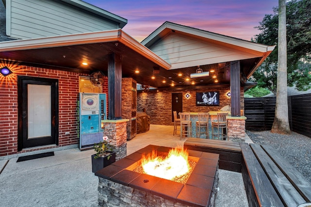 16015 Maycrest Ct, Tomball, TX 77377 - view of patio / terrace featuring fence, outdoor dry bar, and a fire pit
