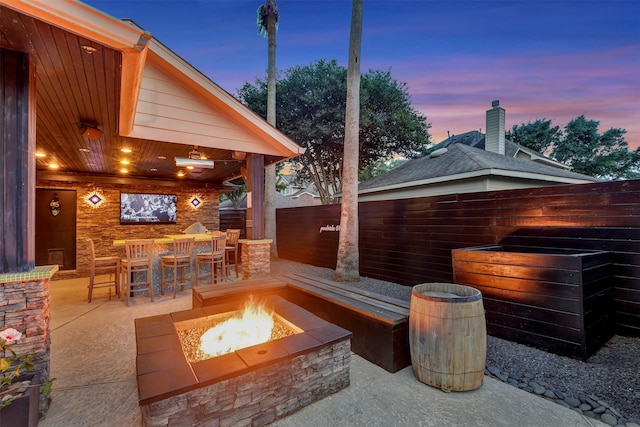 16015 Maycrest Ct, Tomball, TX 77377 - view of patio / terrace featuring an outdoor fire pit, fence, and outdoor dry bar