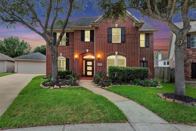 16015 Maycrest Ct, Tomball, TX 77377 - view of front facade with fence, a garage, a front lawn, and brick siding