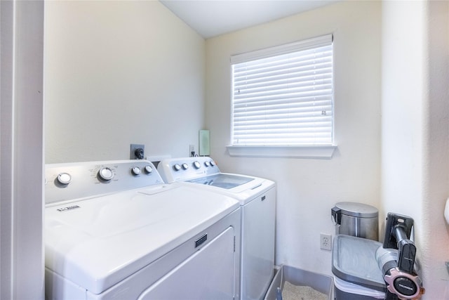 washroom featuring laundry area and independent washer and dryer